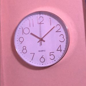 A rose gold clock